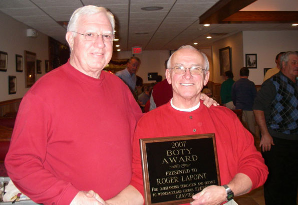 Roger LaPoint accepts B.O.T.Y. award from chapter president, Richard Voakes.