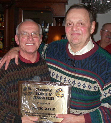 Jack Kile accepts B.O.T.Y. award from chapter president, Richard Voakes.