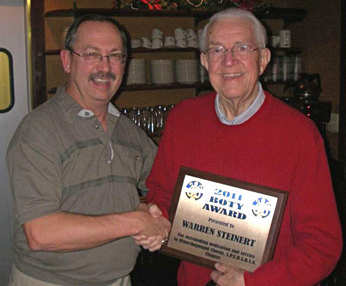 Warren Steinert accepts B.O.T.Y. award from chapter president, Mike Gray.