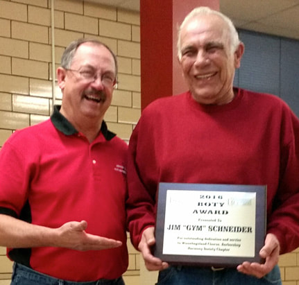 Greg Bellmer accepts B.O.T.Y. award from chapter president, Mike Gray.