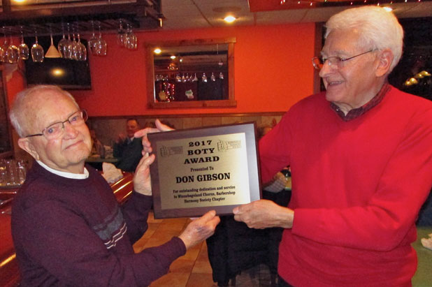 Greg Bellmer accepts B.O.T.Y. award from chapter president, Mike Gray.